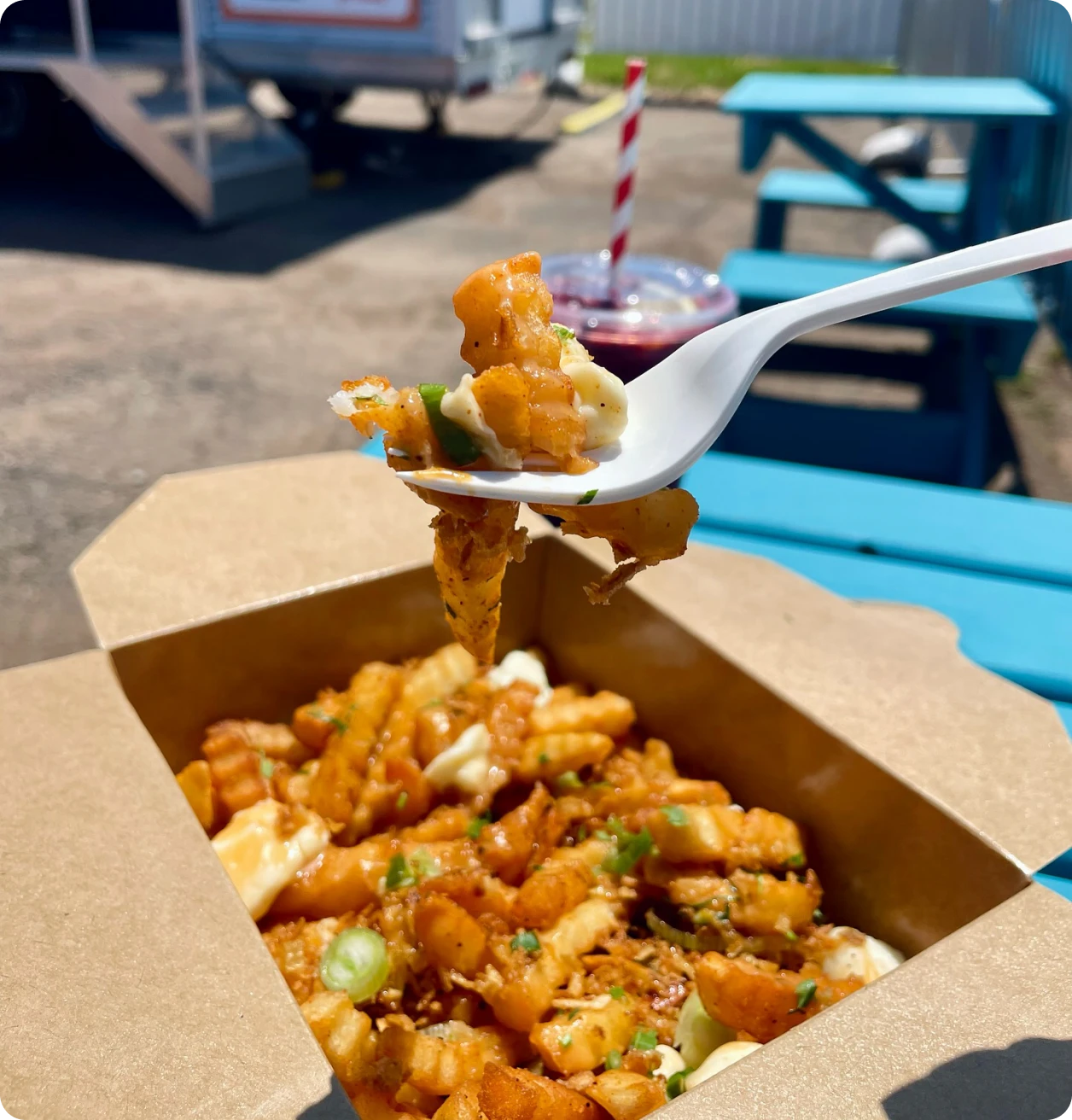 Crinkle-cut fries in cardboard container